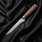 Daichi Honesuki Boning Knife · full blade on black silk