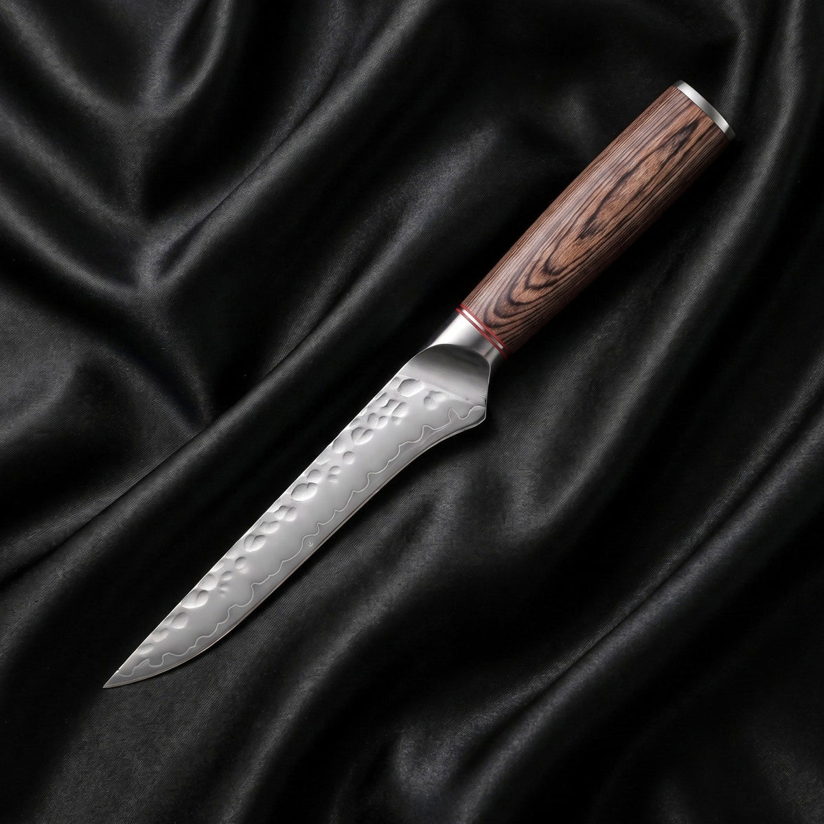 Daichi Honesuki Boning Knife · full blade on black silk