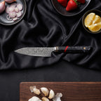 Hibana Knife Duo (Gyuto & Utility) · Utility Knife on the cutting board