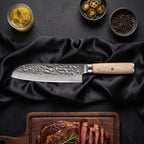 Kinari 7-Piece Knife Set · Santoku All-Purpose Knife on the cutting board
