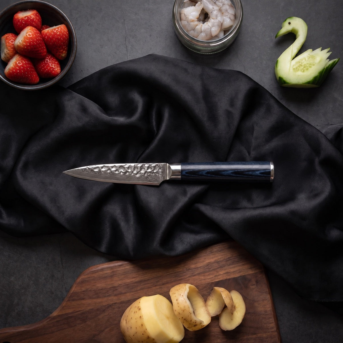 Konpeki 5-Piece Knife Set · Paring Knife on the cutting board