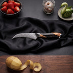 Yoizuki 6-Piece Knife Set · Bird's Beak Peeling Knife on the cutting board