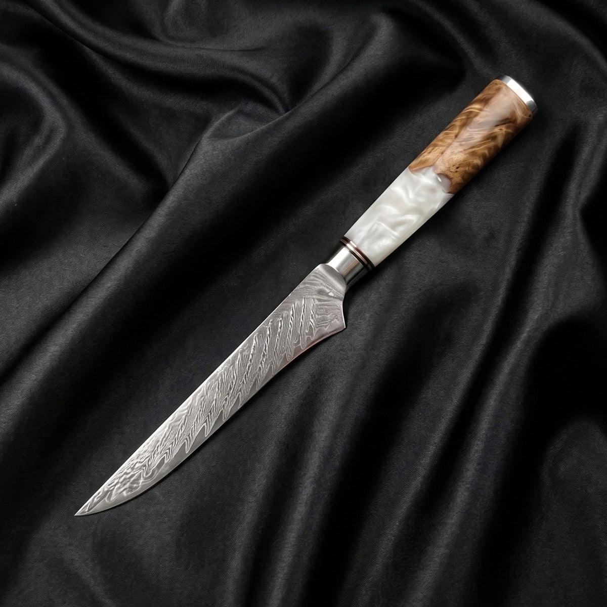 Shinju Honesuki Boning Knife · full blade on black silk