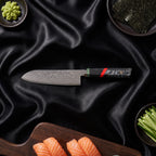 Enji 9-Piece Knife Set · 7 in Santoku All-Purpose Knife on the cutting board