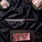 Enji 9-Piece Knife Set · Honesuki Boning Knife on the cutting board