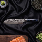 Konpeki 5-Piece Knife Set · Santoku All-Purpose Knife on the cutting board