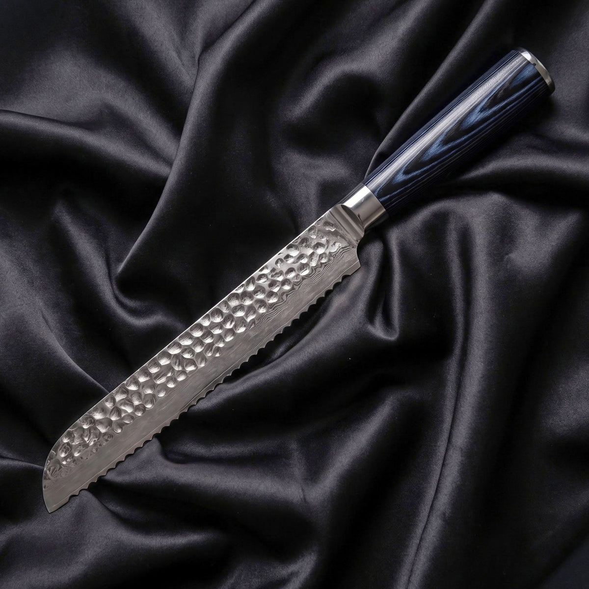 Konpeki Bread Knife · full blade on black silk