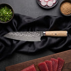 Kinari 7-Piece Knife Set · Kiritsuke Chef-Slicer Knife on the cutting board