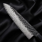 Sumie Gyuto Chef Knife · Damascus blade close-up