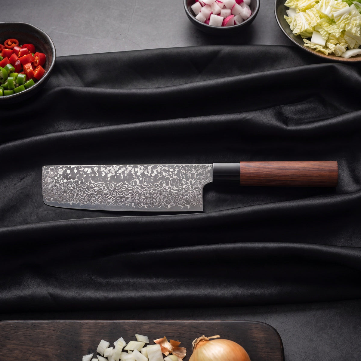 Tsubaki 3-Piece Knife Set · Nakiri Vegetable Knife on the cutting board