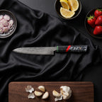 Enji Knife Duo (Gyuto & Utility) · Utility Knife on the cutting board