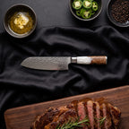 Shinju 5 in Santoku All-Purpose Knife · on the cutting board