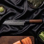 Kurumi 5-Piece Knife Set · Santoku All-Purpose Knife on the cutting board