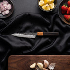 Sumie Petty Knife · on the cutting board