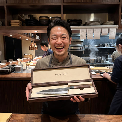 Young chef with HARUTANI knife box, Tokyo