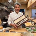 Chef presenting an open HARUTANI knife box