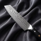 Homura Kiritsuke Chef Knife · Damascus blade close-up