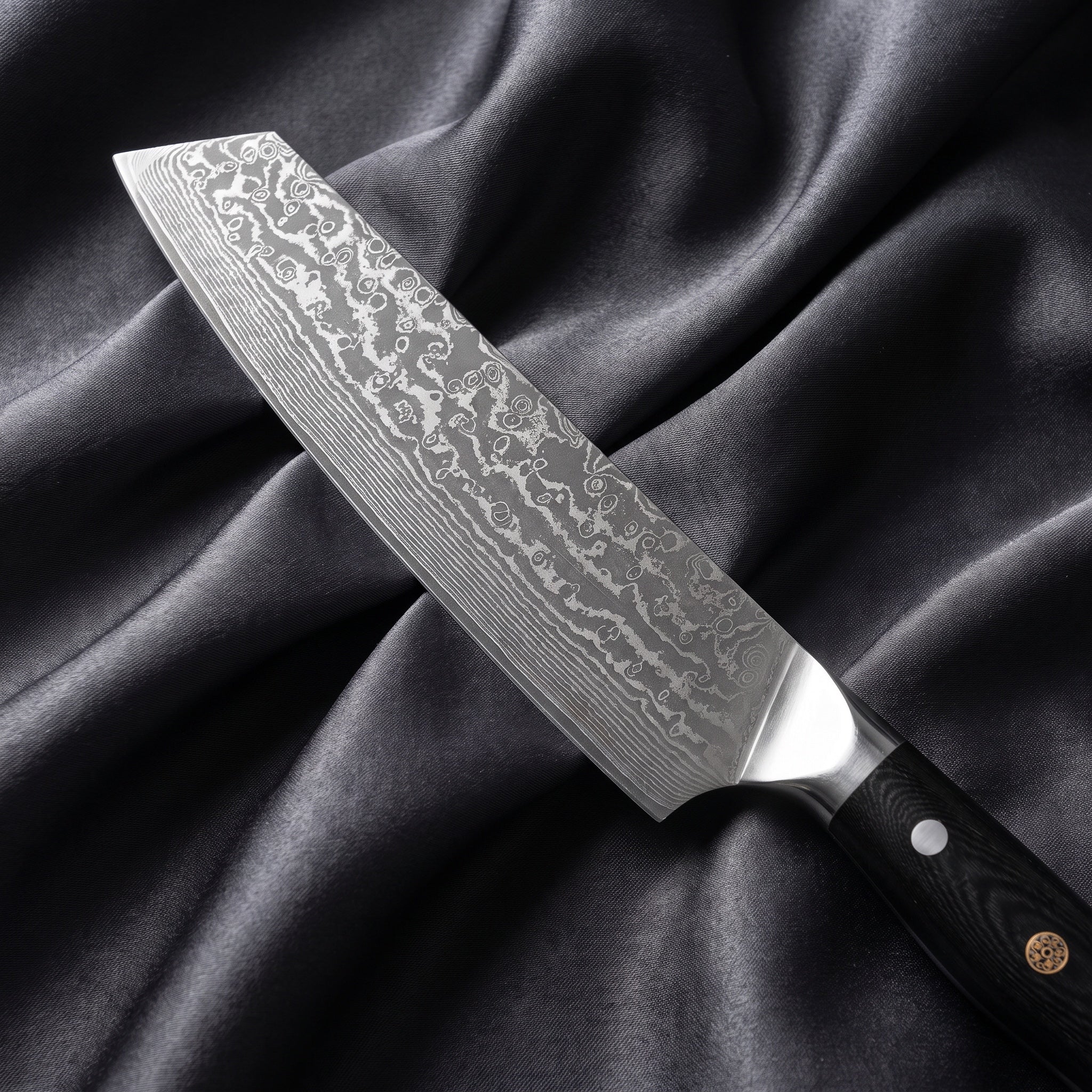 Homura Kiritsuke Chef Knife · Damascus blade close-up
