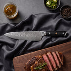 Homura Knife Trio (Gyuto, Nakiri & Petty) · Gyuto on the cutting board