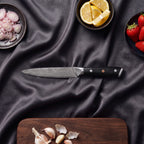 Homura Knife Trio (Gyuto, Nakiri & Petty) · Petty on the cutting board