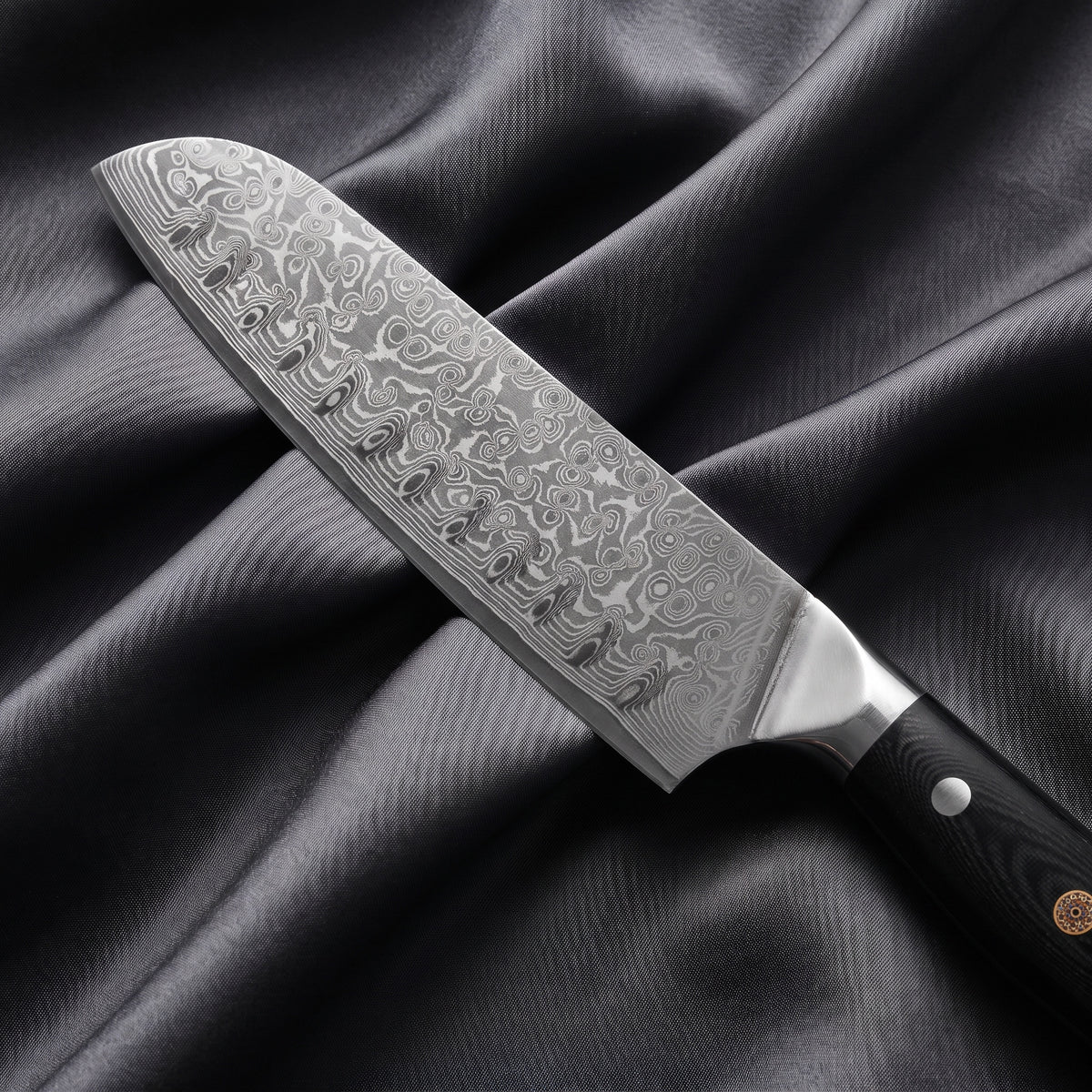 Homura Santoku Knife · Damascus blade close-up
