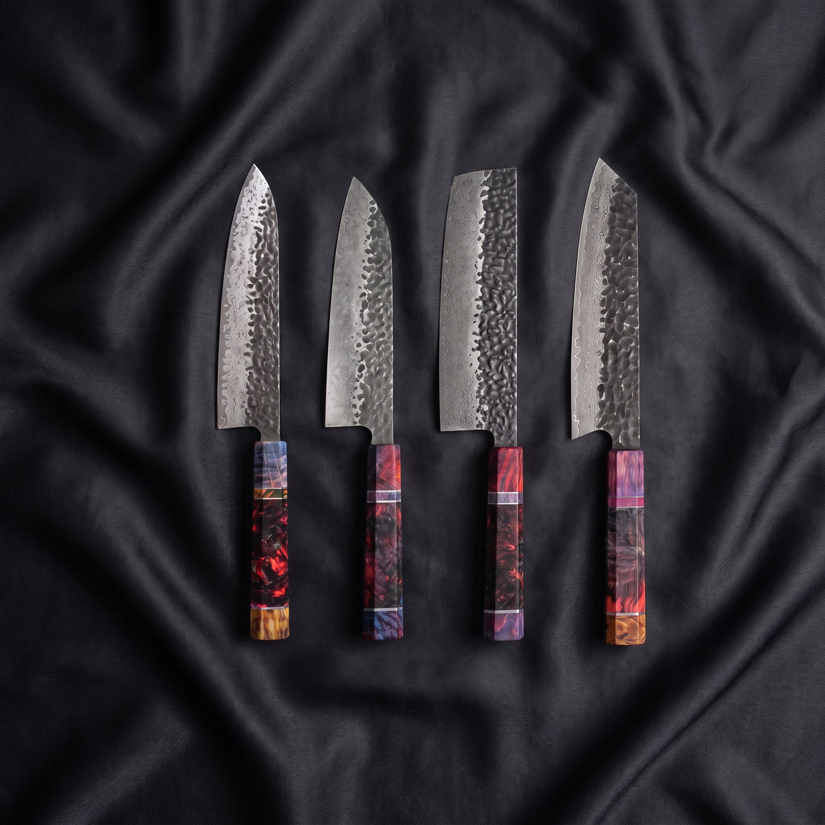 Hotaru Damascus Knife Set · the full set on black silk