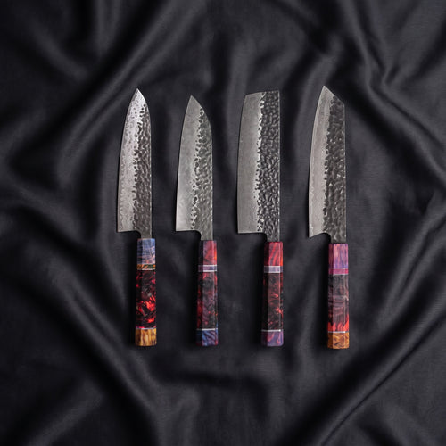 Hotaru Damascus Knife Set · the full set on black silk