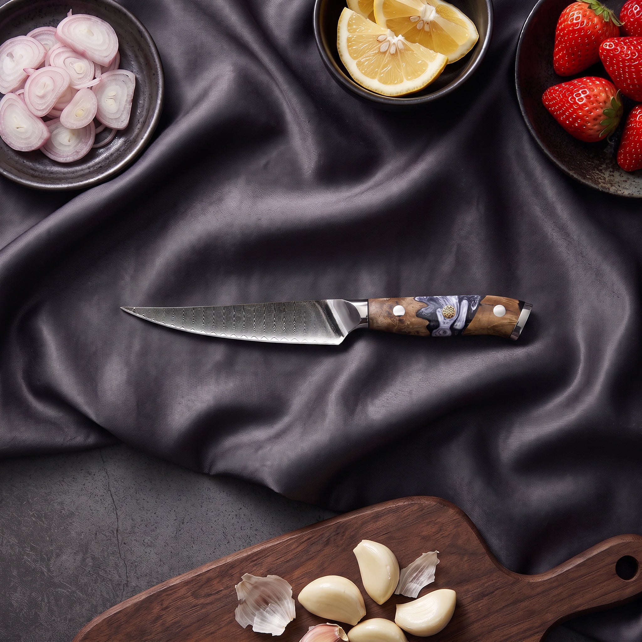 Hyoga Damascus Knife Set · on the cutting board