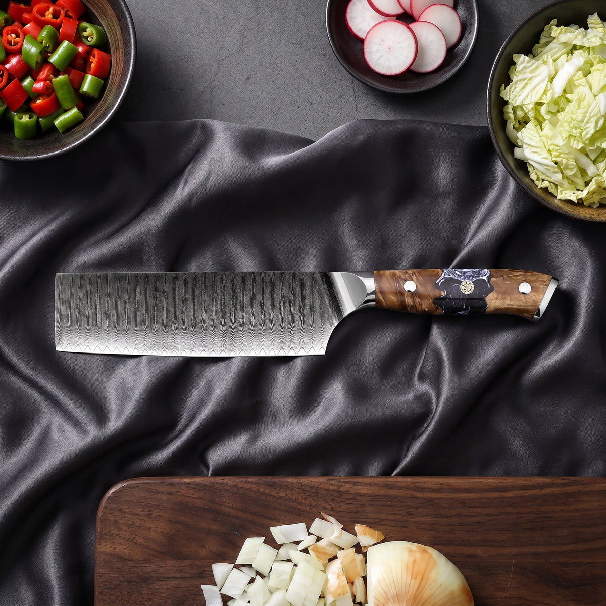 Hyoga Knife Trio (Gyuto, Nakiri & Petty) · on the cutting board