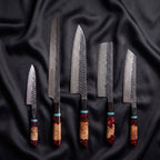 Minato Damascus Knife Set · the full set on black silk