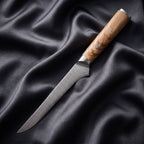 Nishiki Honesuki Boning Knife · full blade on black silk