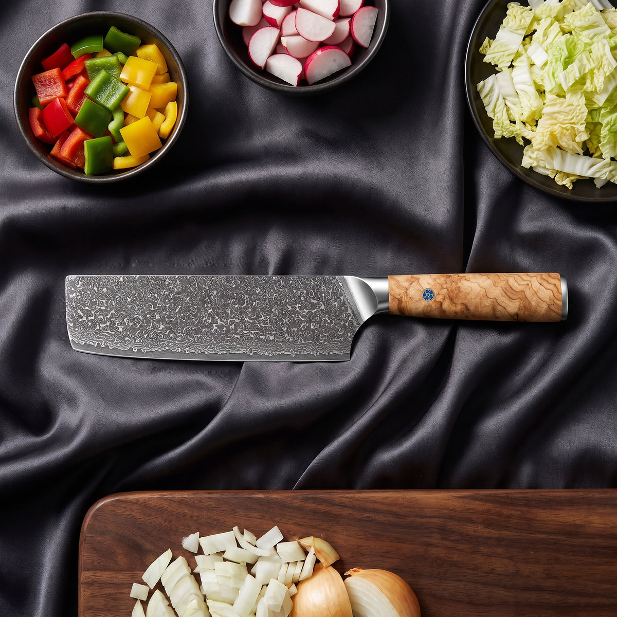 Nishiki Knife Trio (Gyuto, Nakiri & Petty) · on the cutting board