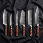 Okami Damascus Knife Set · the full set on black silk