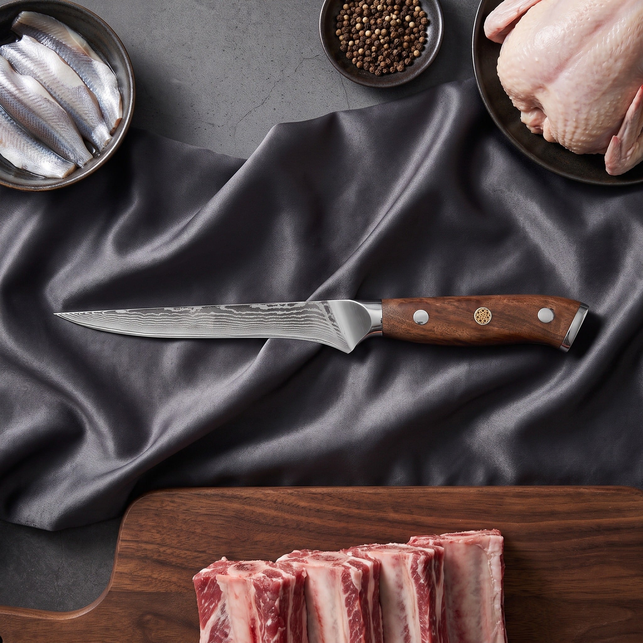 Okami Damascus Knife Set · Honesuki on the cutting board