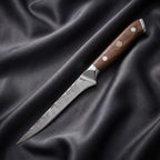 Okami Honesuki Boning Knife · full blade on black silk