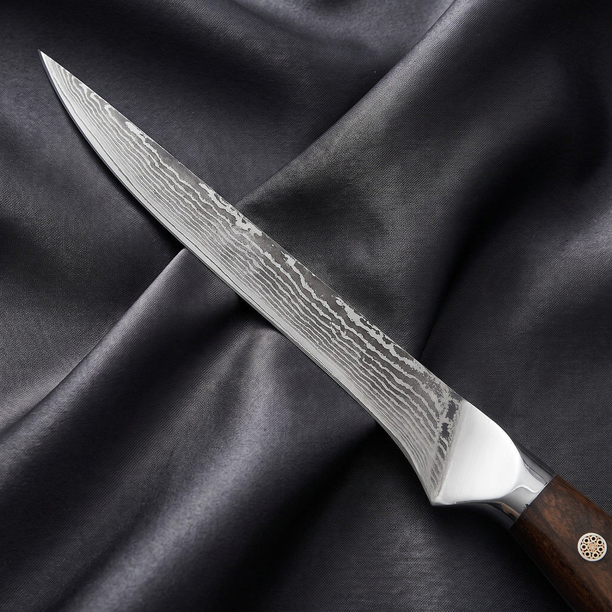 Okami Honesuki Boning Knife · Damascus blade close-up