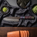 Rekka Santoku Knife · on the cutting board