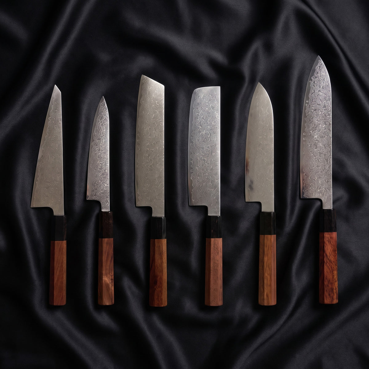 Samidare Damascus Knife Set · the full set on black silk