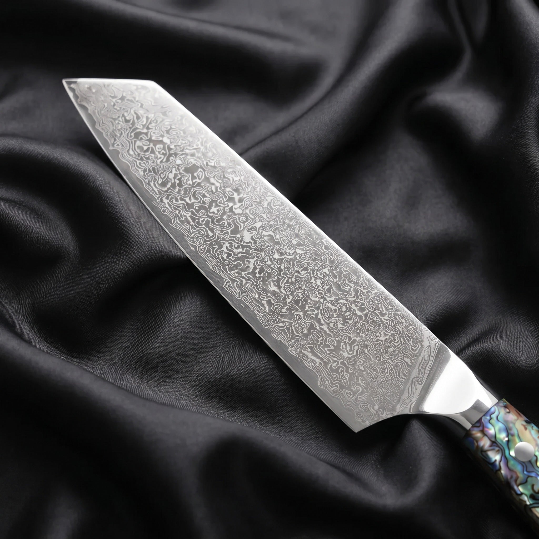 Shizuku Kiritsuke Chef Knife · Damascus blade close-up