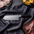 Tsurugi Damascus Knife Set · Cleaver on the cutting board
