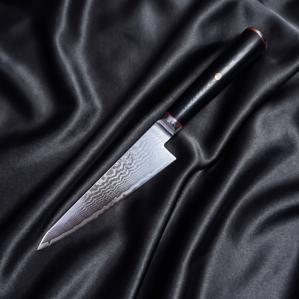 Tsurugi Honesuki Boning Knife · full blade on black silk
