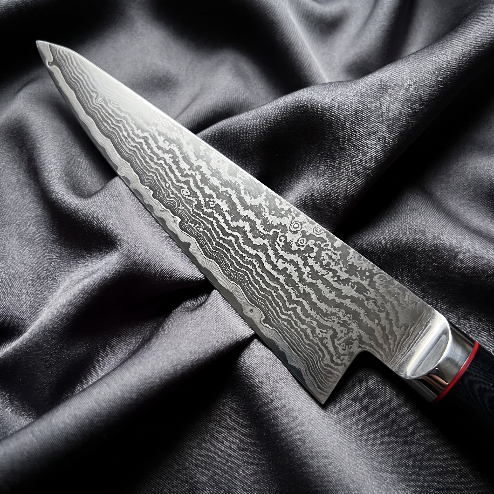 Tsurugi Honesuki Boning Knife · Damascus blade close-up