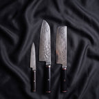 Tsurugi Knife Trio (Santoku, Nakiri & Petty) · the full set on black silk