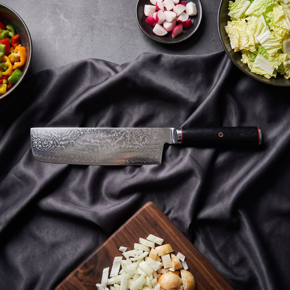 Tsurugi Knife Trio (Santoku, Nakiri & Petty) · Nakiri on the cutting board