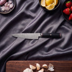 Tsurugi Petty Utility Knife · on the cutting board