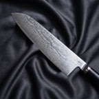 Tsurugi Santoku Knife · Damascus blade close-up