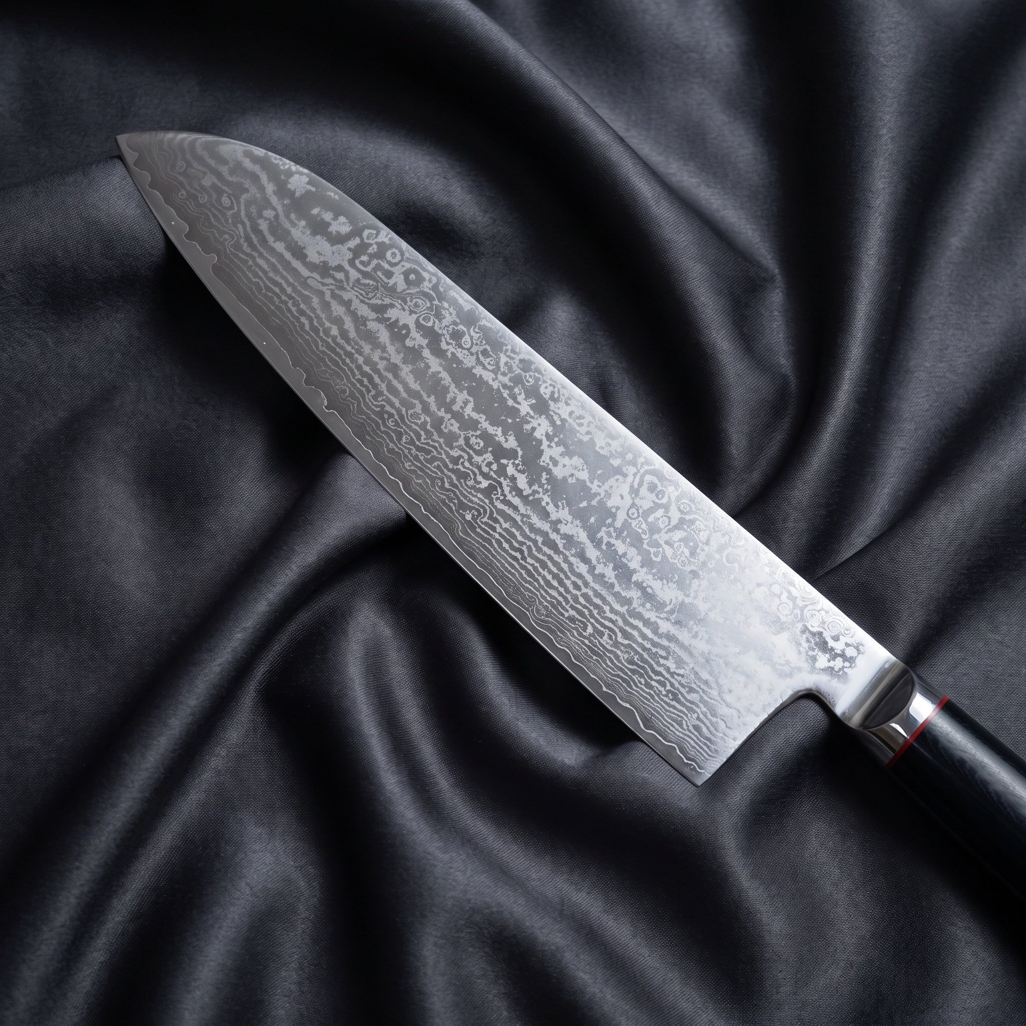 Tsurugi Santoku Knife · Damascus blade close-up