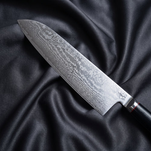 Tsurugi Santoku Knife · Damascus blade close-up