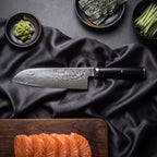 Tsurugi Santoku Knife · on the cutting board